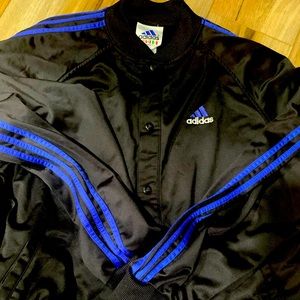 Adidas black button down light weight jacket with blue stripes. Size xl